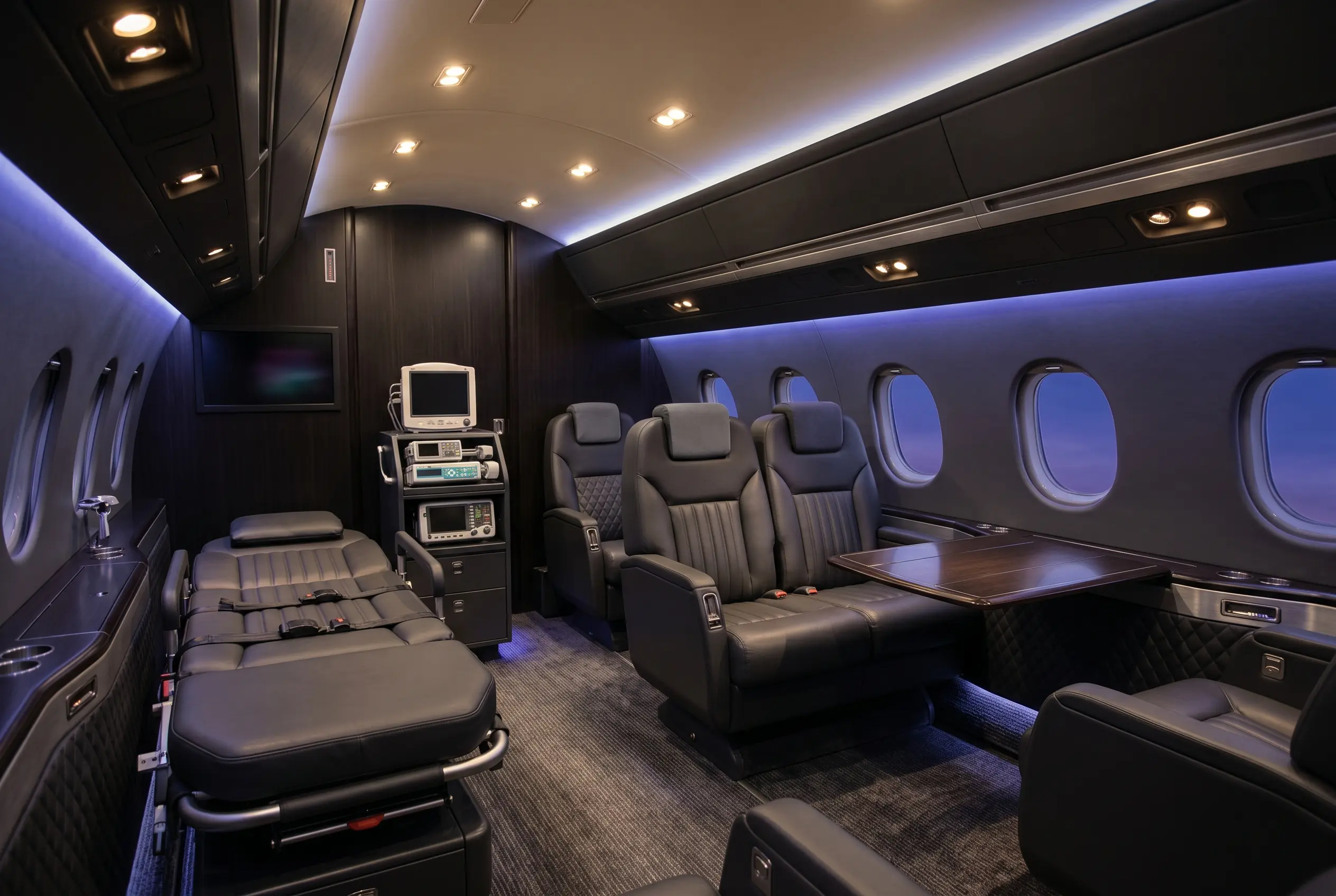 Medically-equipped private jet interior configured for patient transport between New York and Miami
