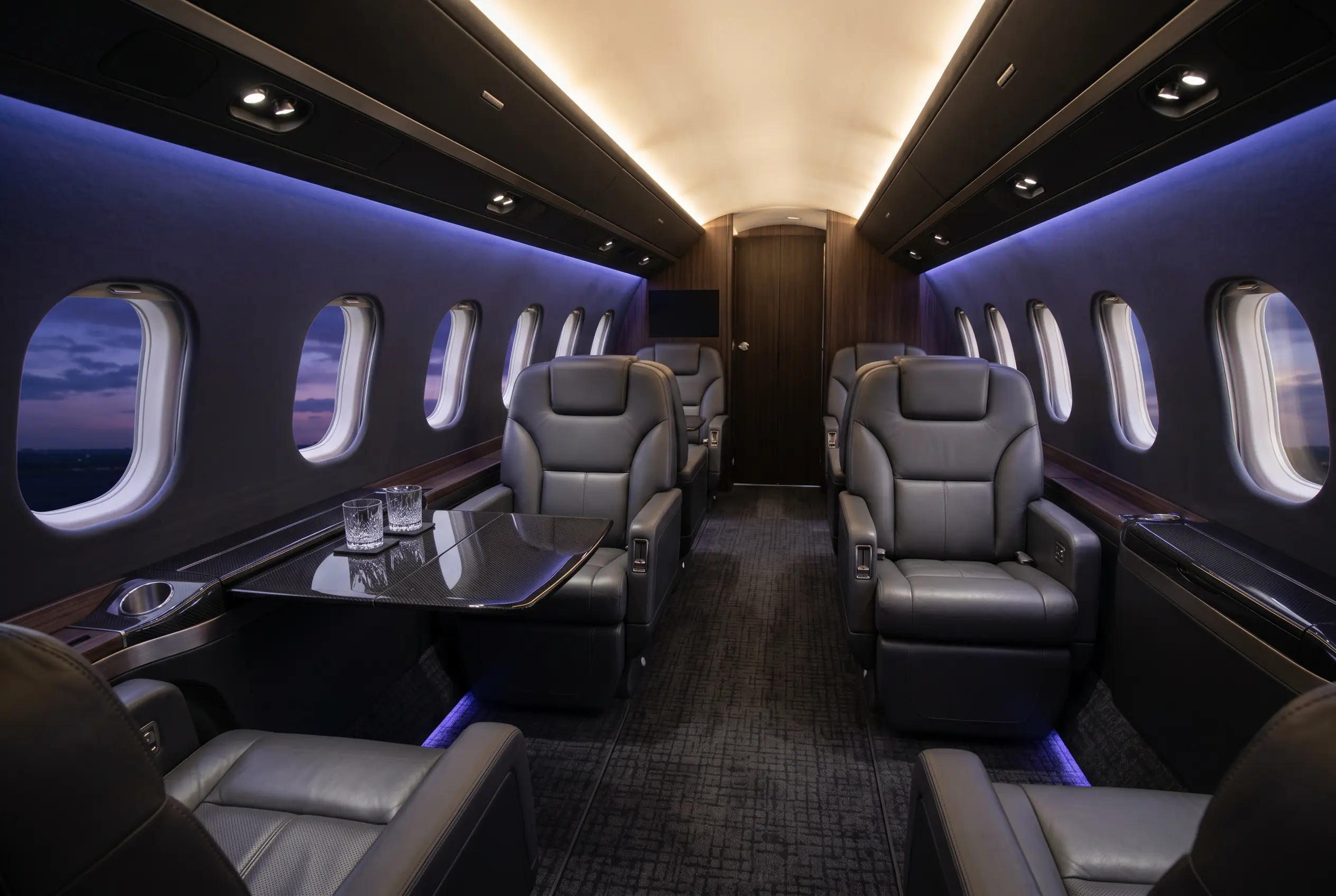 Bombardier Challenger 300 wide flat-floor cabin with double-club seating, configured for a New York to Miami charter