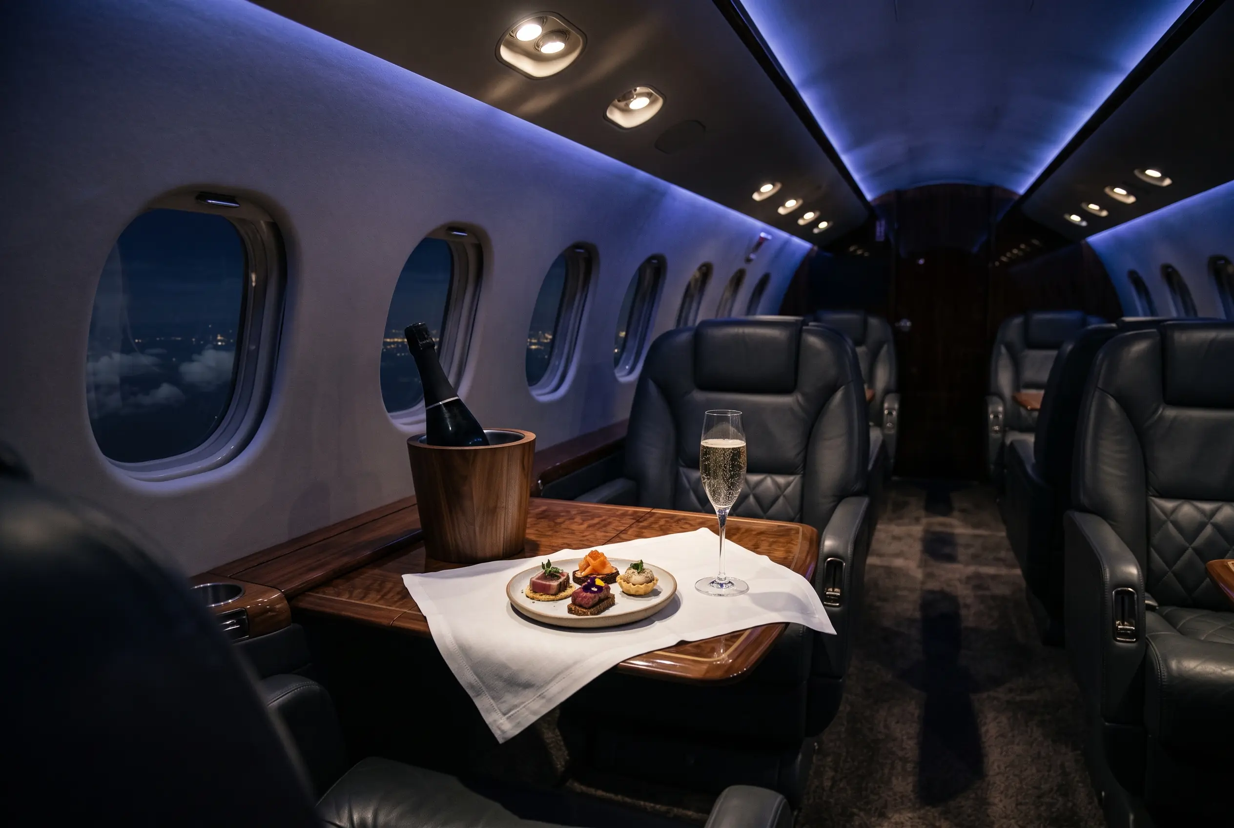 Bespoke catering and champagne laid out in a private jet cabin for a New York to Miami flight