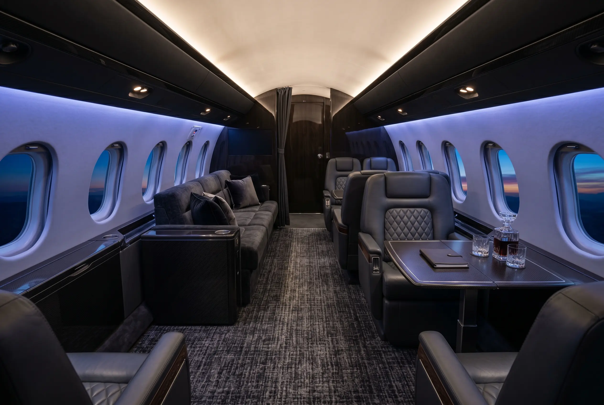 Bombardier Global 5000 wide large cabin with club and divan seating, configured for a New York to Miami charter