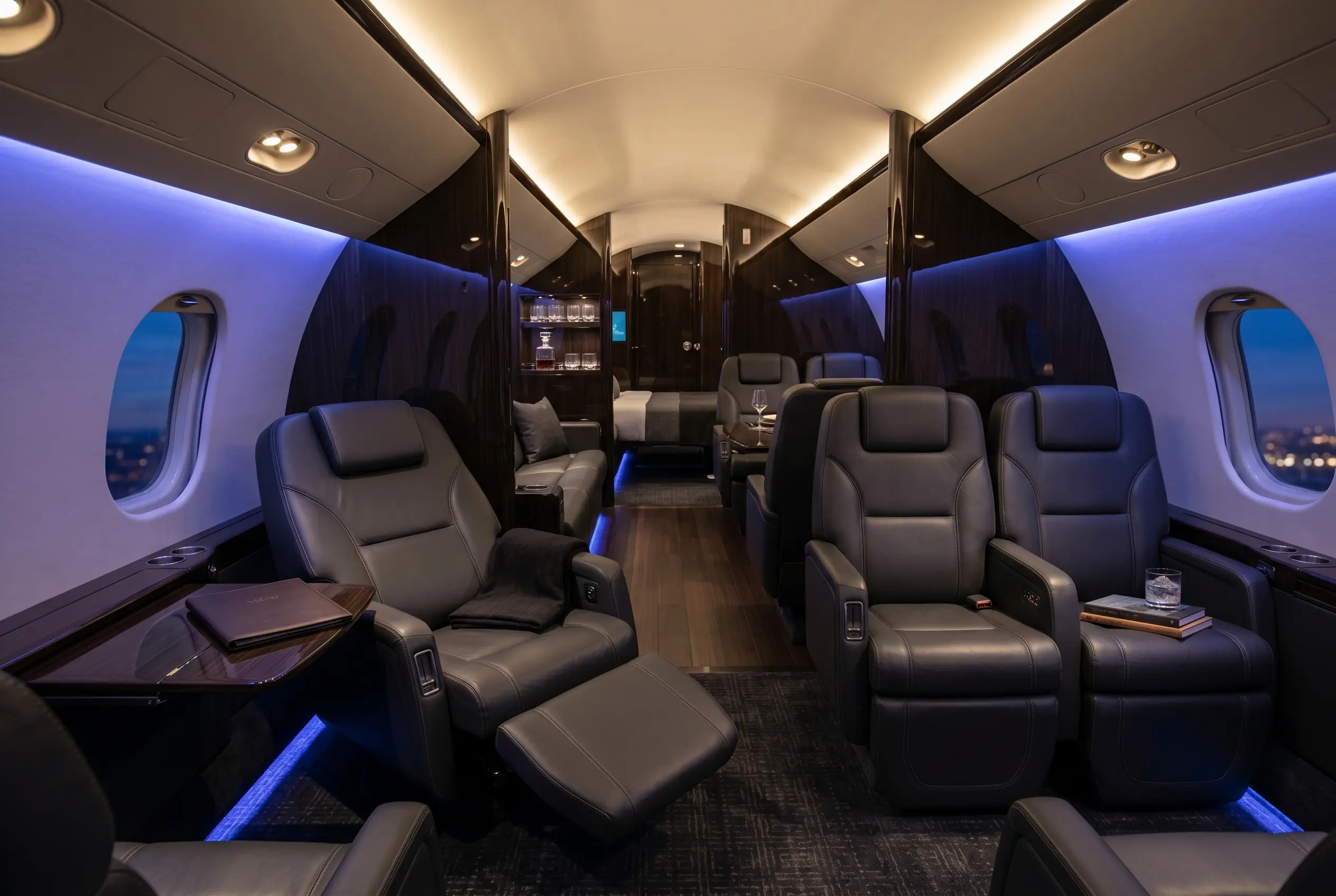 Bombardier Global 5500 large cabin with three living zones and a deep recline seat, configured for a New York to Miami charter