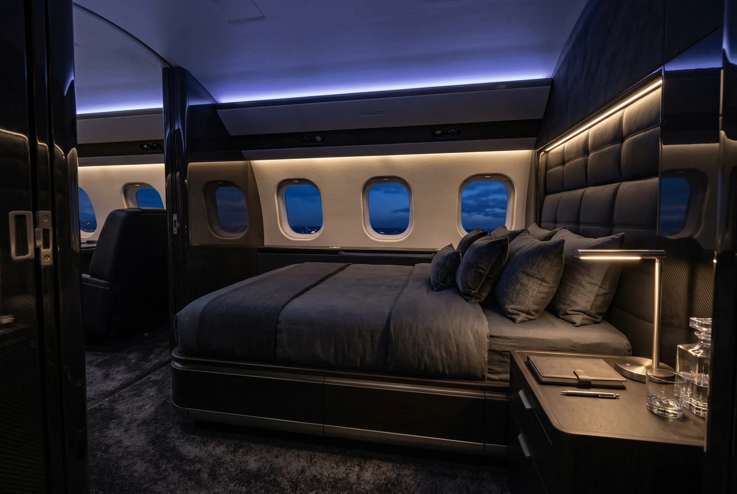 Private aft master suite with a full bed in a Bombardier Global 7500 during a New York to Miami flight