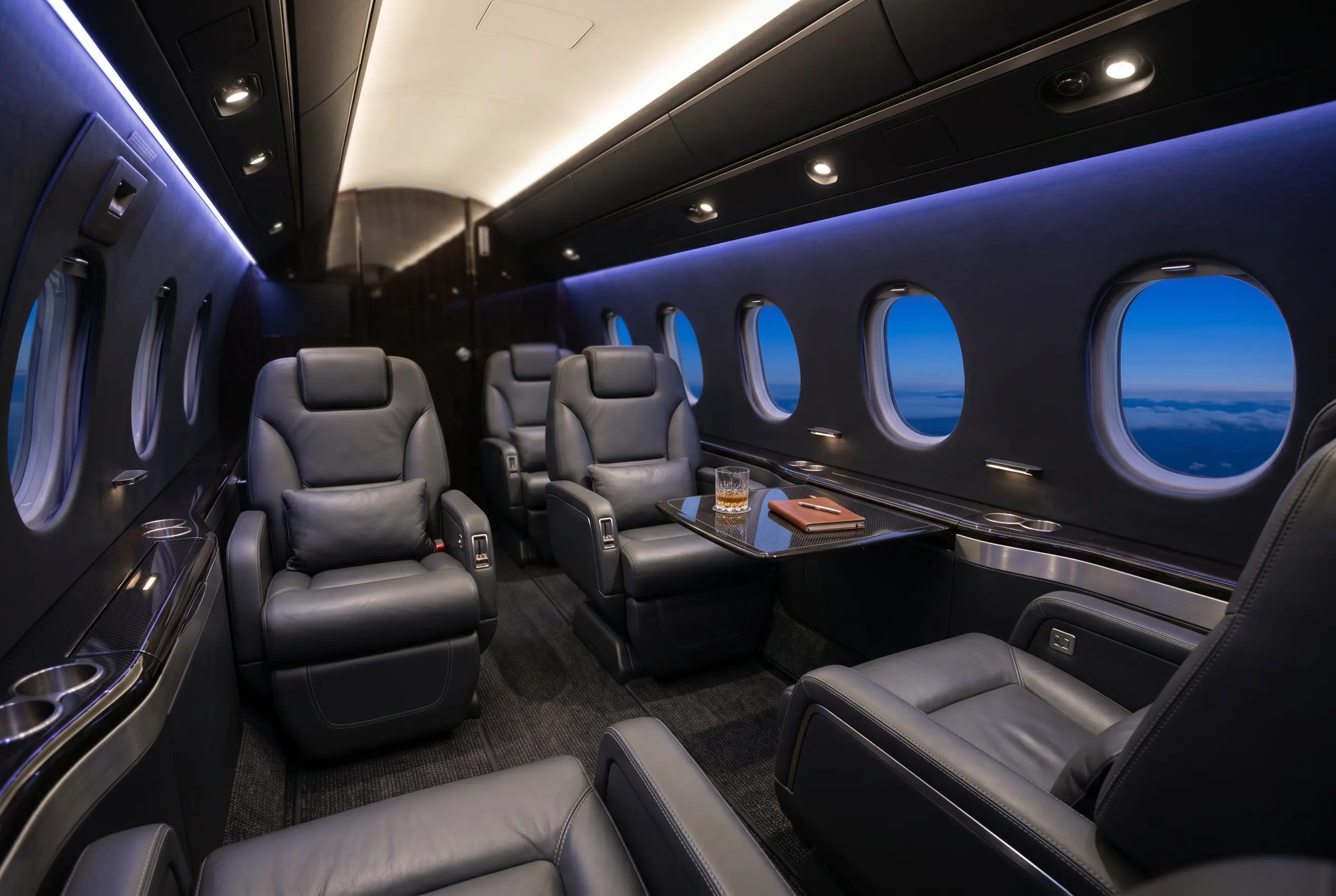 Gulfstream G150 cabin with club seating and Gulfstream oval windows, configured for a New York to Miami charter