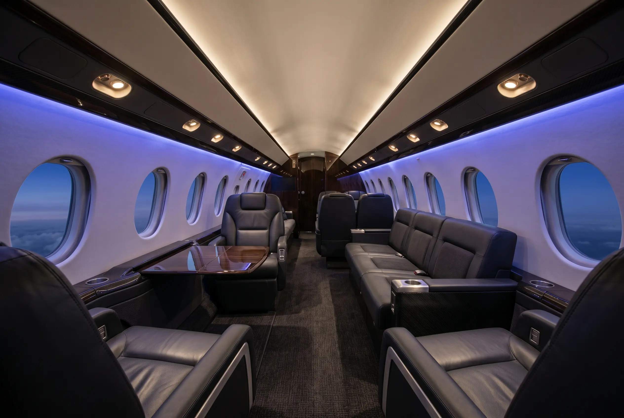 Gulfstream G200 very wide cabin with club seating and a divan, configured for a New York to Miami charter