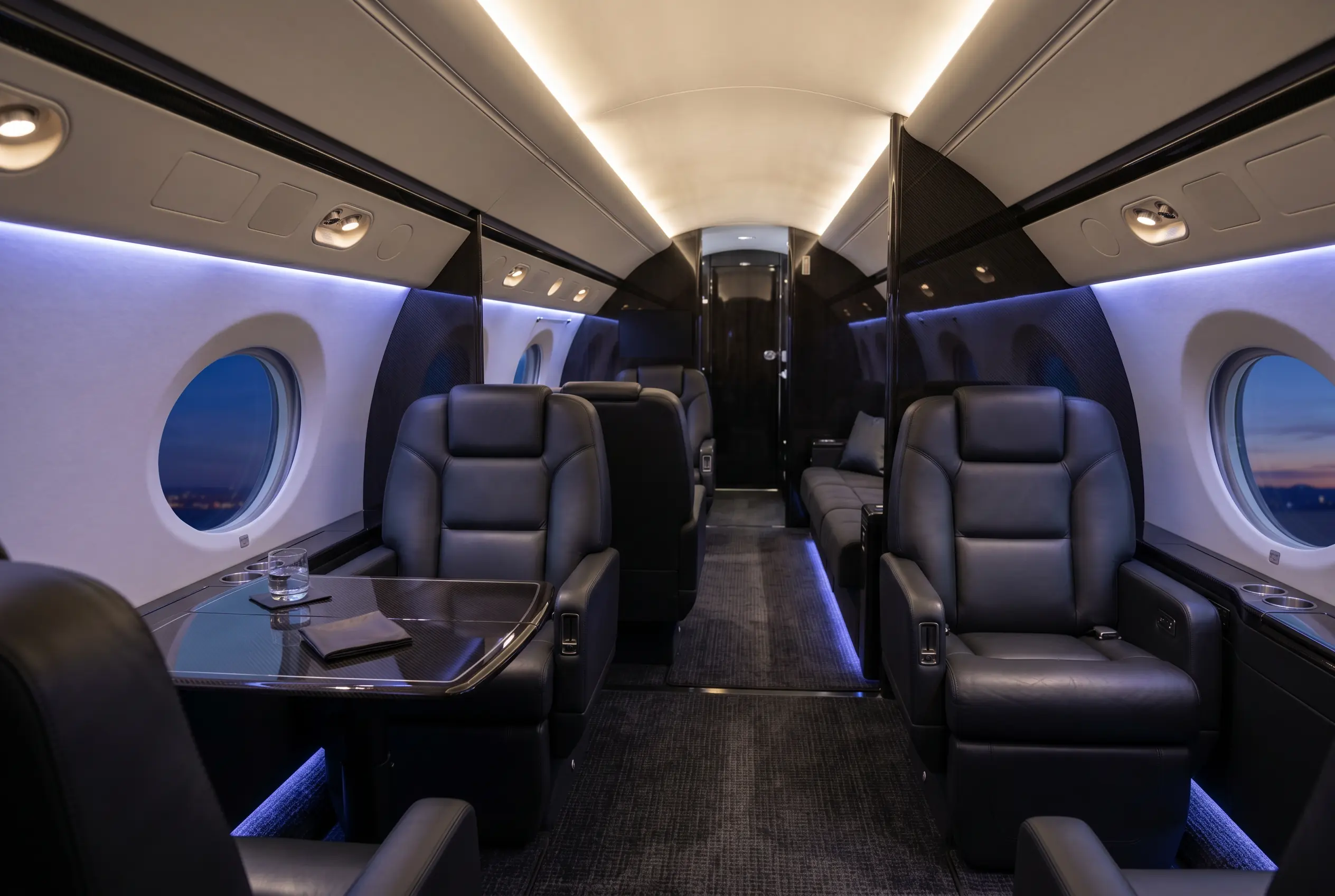 Gulfstream G450 large cabin in three living zones with signature oval windows, configured for a New York to Miami charter