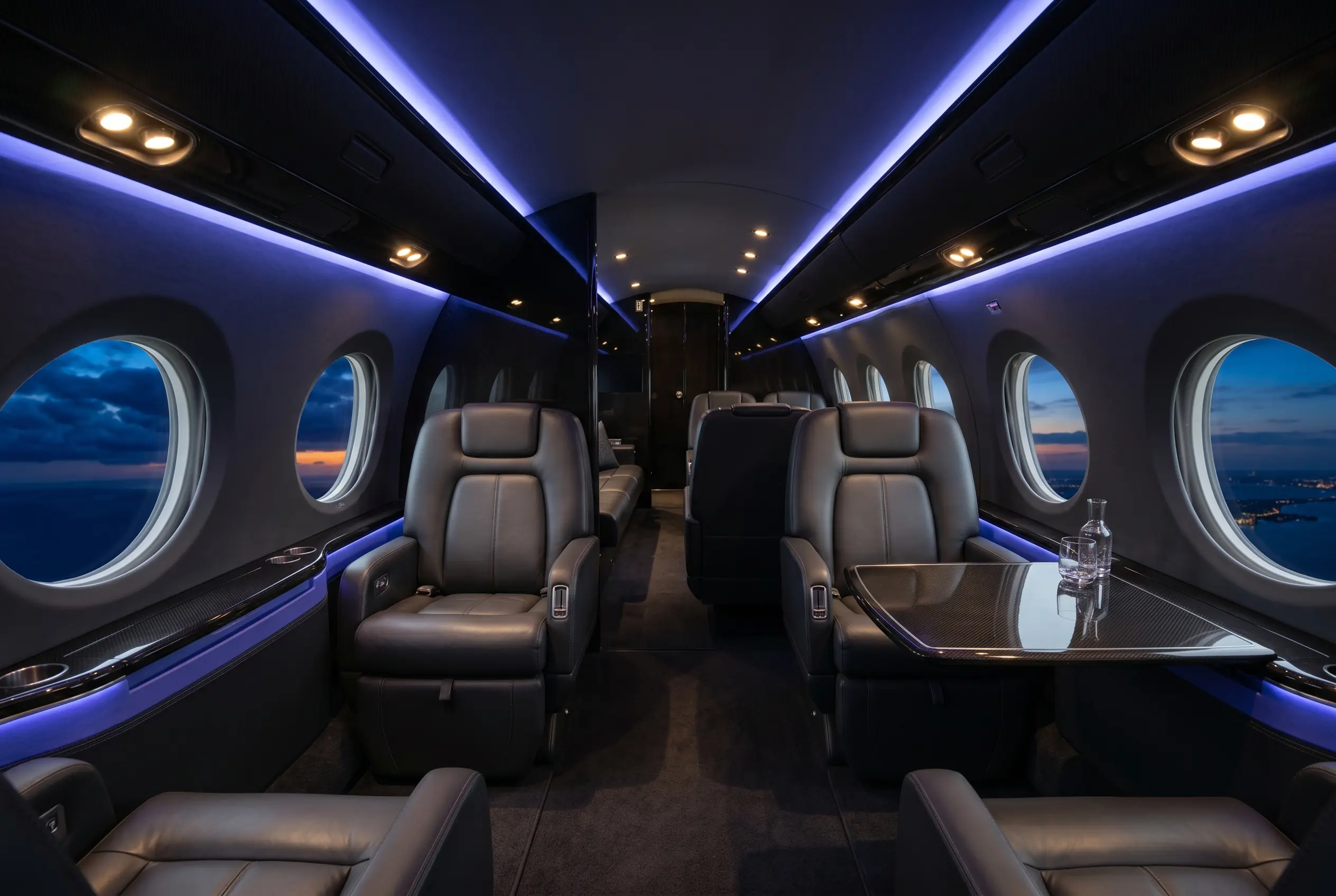 Gulfstream G550 large cabin with three living zones and club seating, configured for a New York to Miami charter