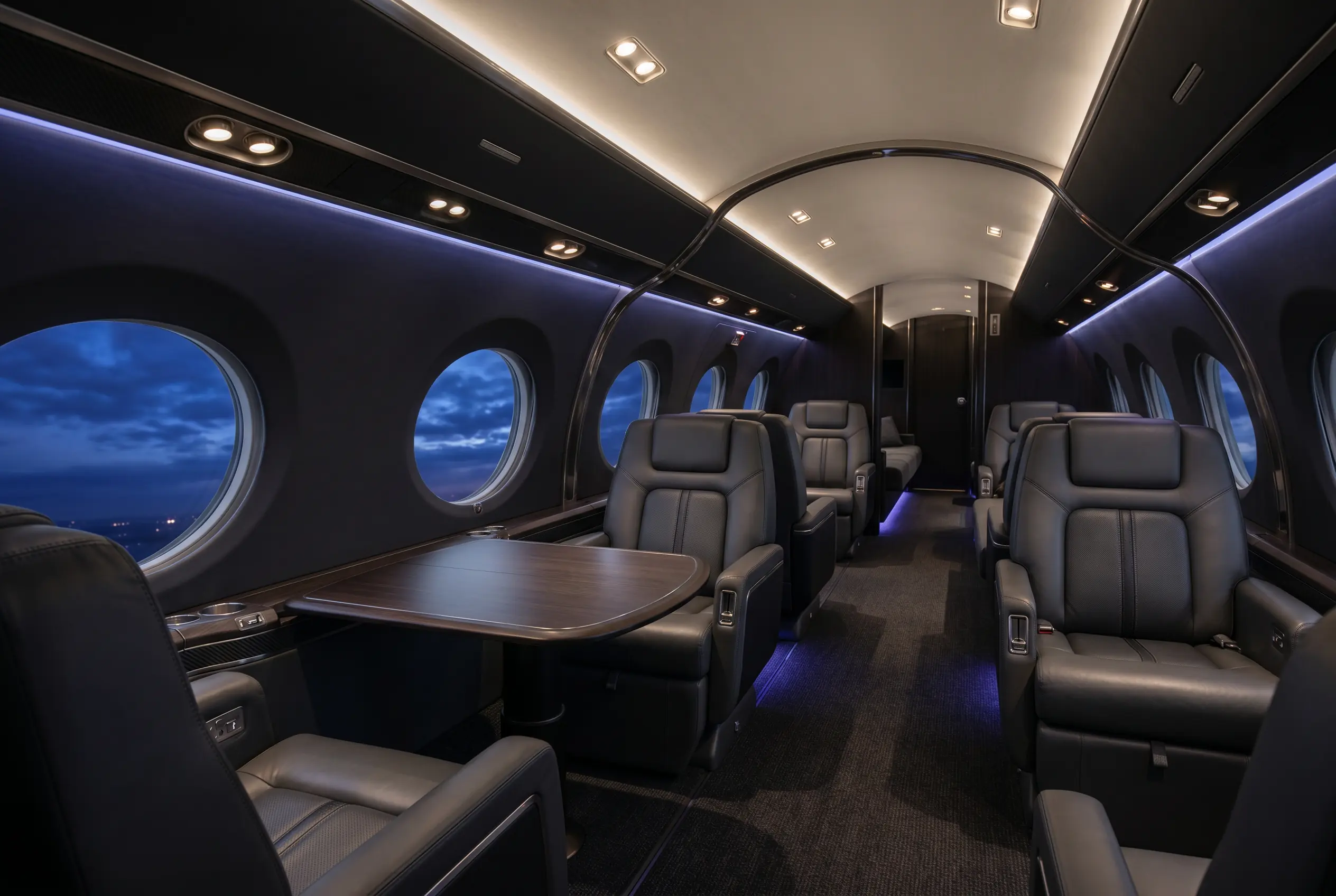 Gulfstream G600 clean-sheet cabin with four living zones and panoramic windows, configured for a New York to Miami charter