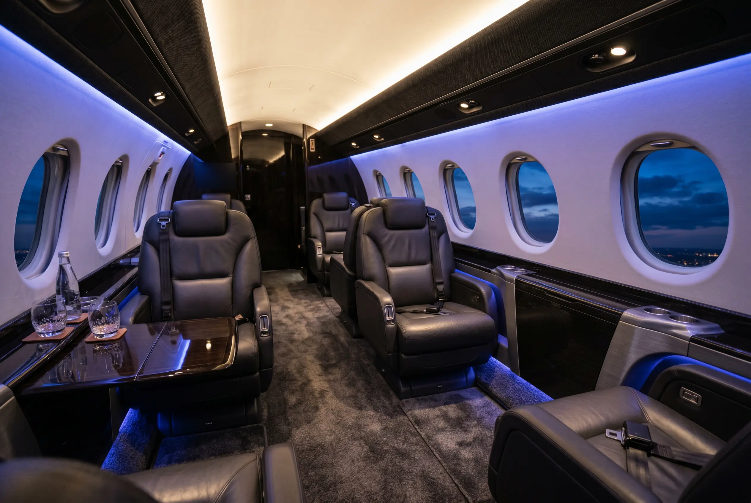 Hawker 900XP wide flat-floor cabin with club seating for a New York to Miami charter