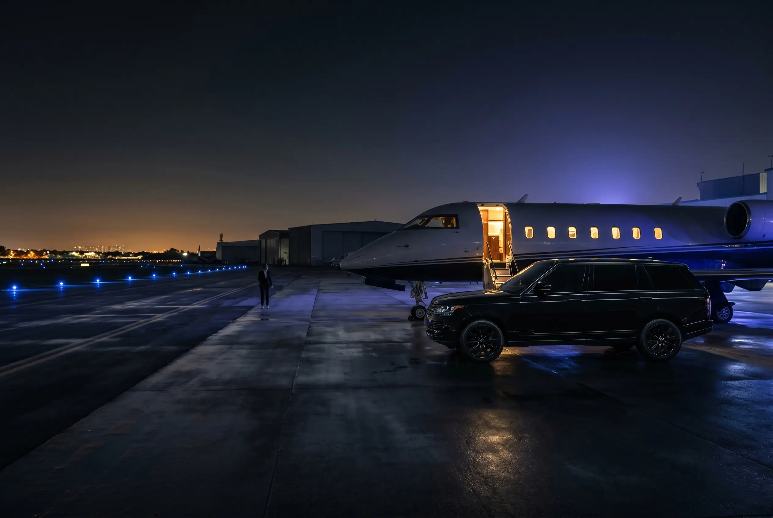 Chauffeured SUV waiting beside a private jet at a Miami FBO to transfer guests to a South Beach event