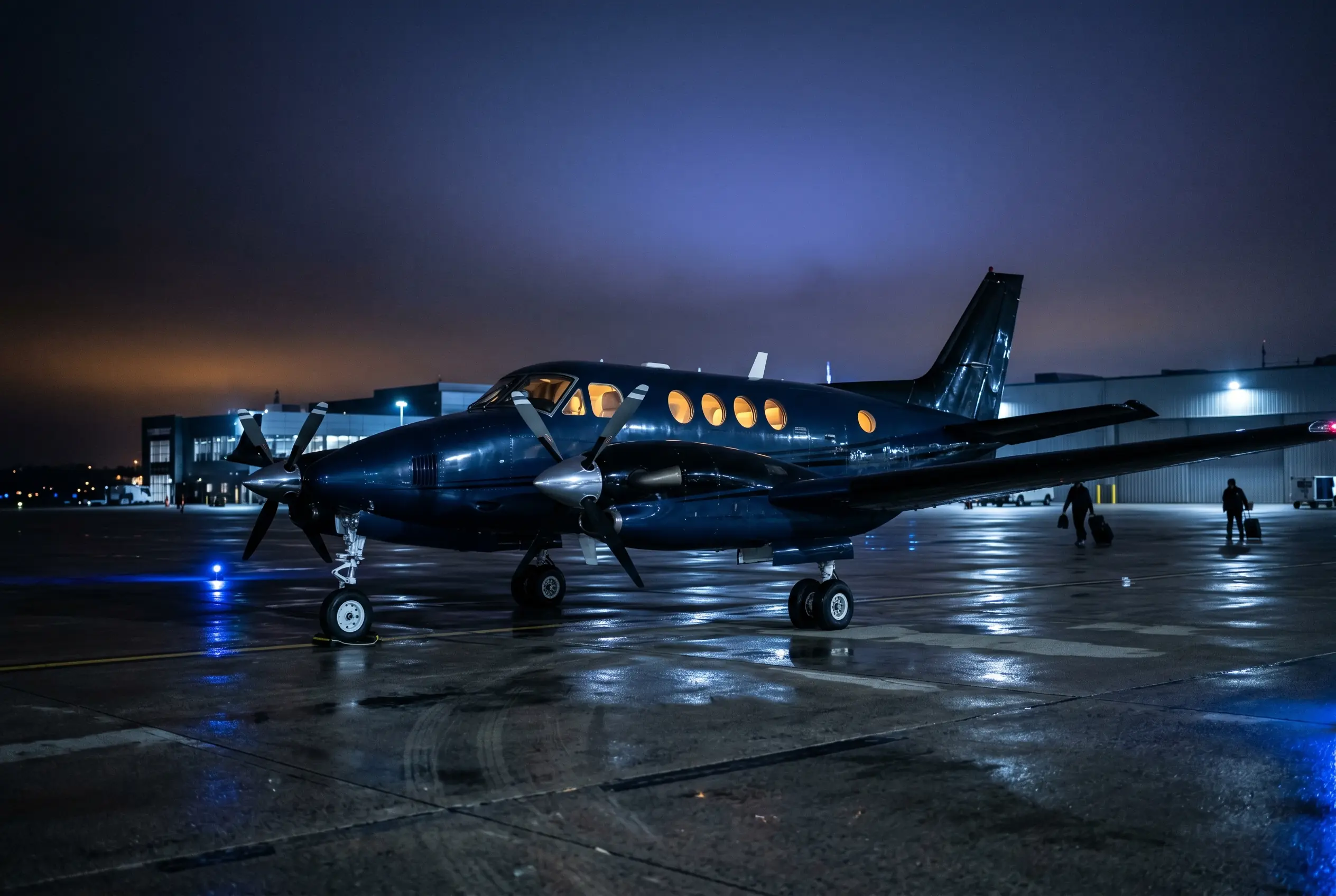 Beechcraft King Air C90GTx twin turboprop on a regional ramp at dusk before a New York to Miami departure