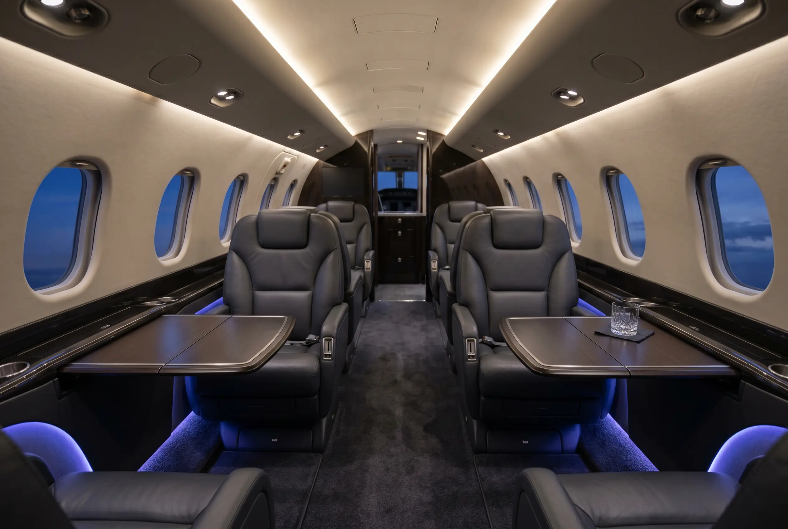 Bombardier Learjet 60XR cabin with double-club seating and stand-up height, configured for a New York to Miami charter