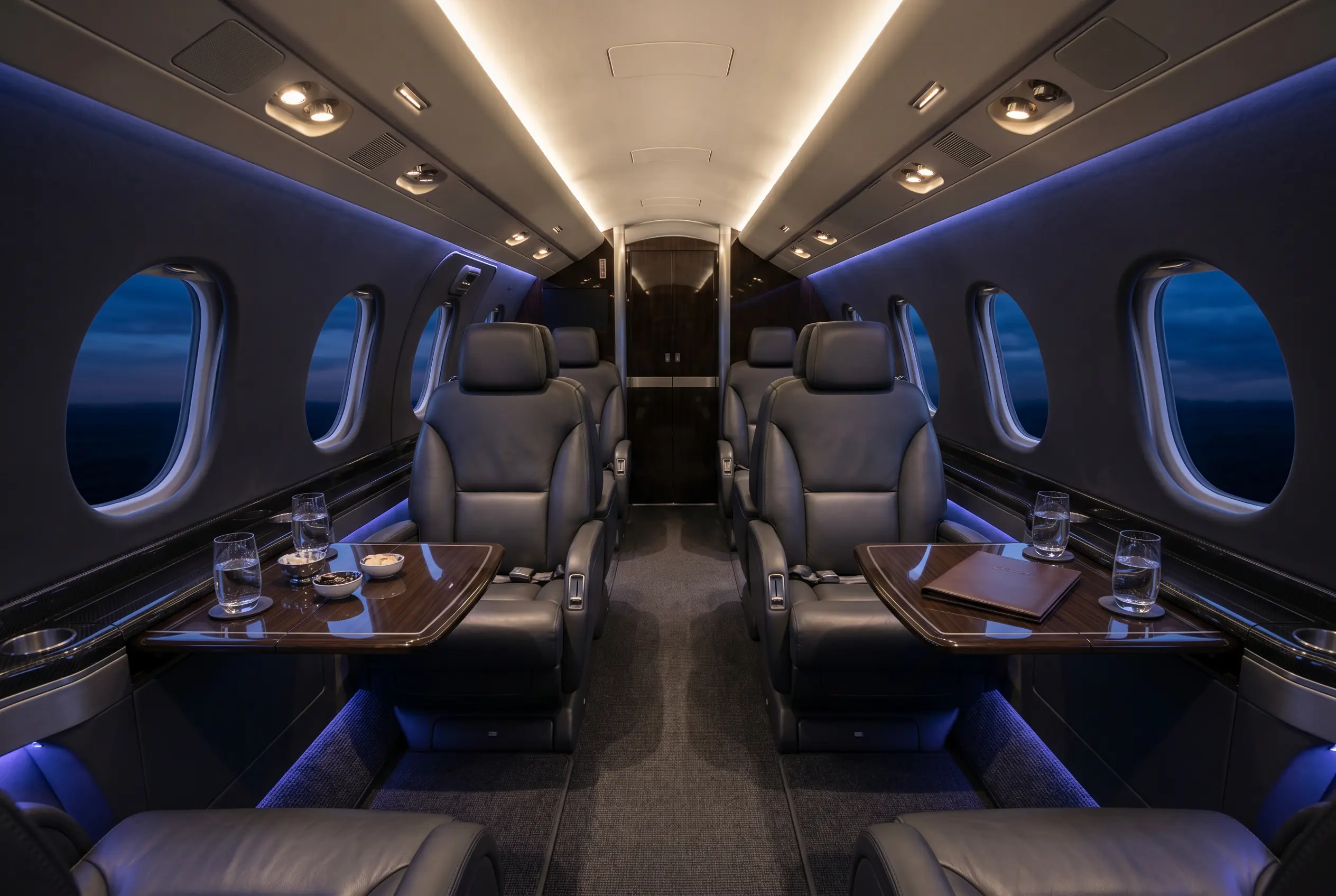 Bombardier Learjet 75 cabin in double-club layout with eight executive seats, configured for a New York to Miami charter