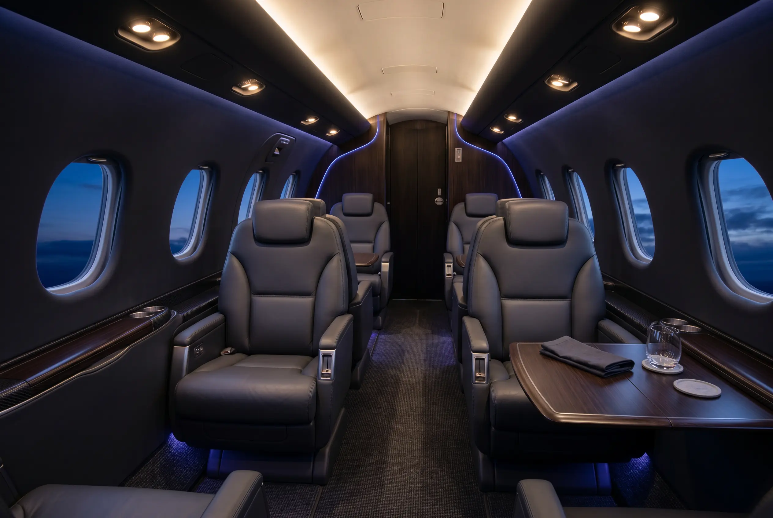 Piaggio Avanti EVO stand-up cabin with club seating and large windows, configured for a New York to Miami charter