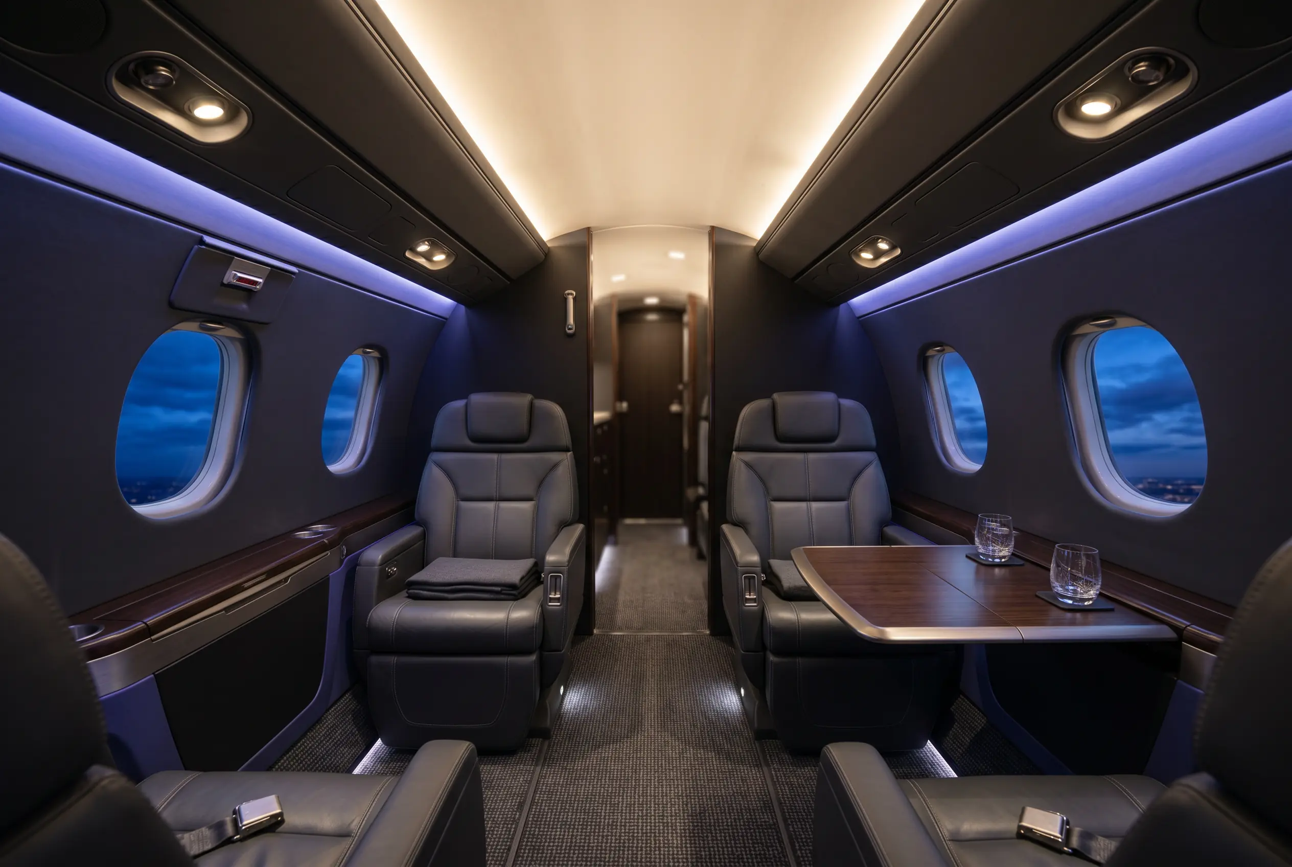 Embraer Praetor 500 flat-floor cabin with six-foot-ten width and club seating, configured for a New York to Miami charter