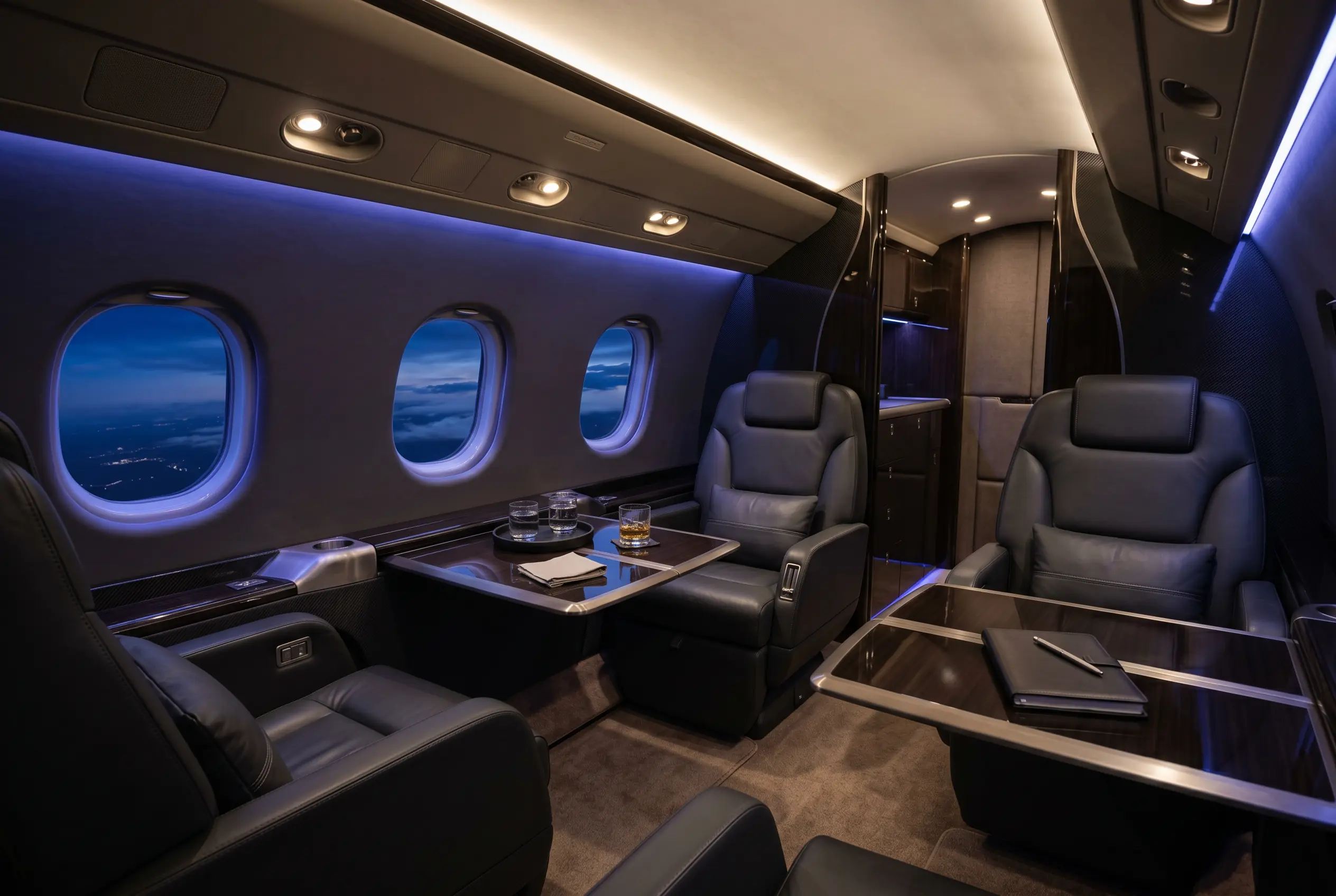 Super-midsize jet aft cabin arranged as a lounge during a New York to Miami flight